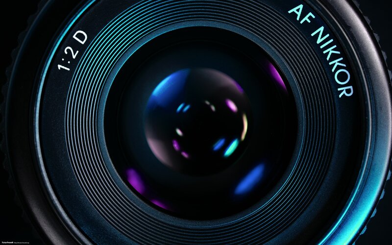 Close-up of Camera Lens — Black, Dramatic, Photograph, Text