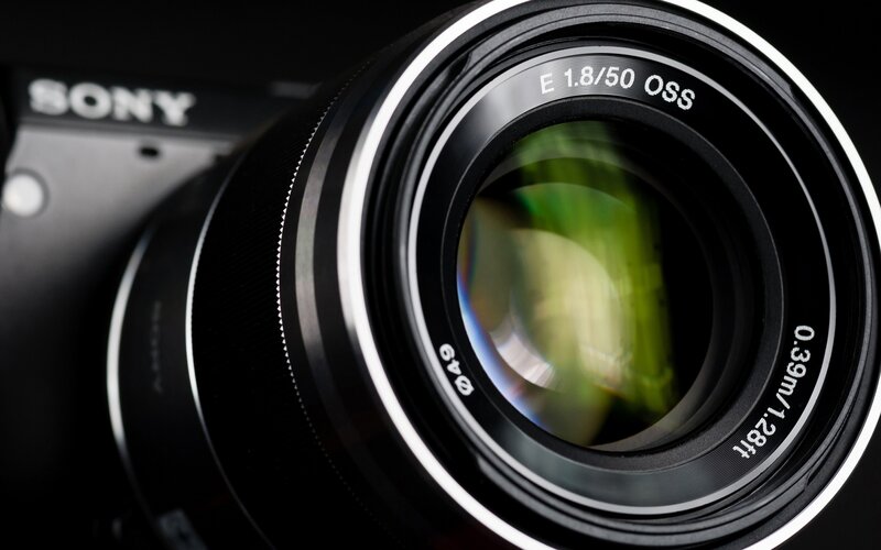 Close-up of Camera Lens — Black, Dramatic, Photograph