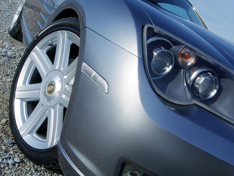 close-up of car wheel and headlight