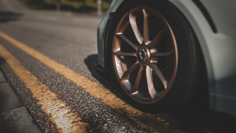 Close-up of Car Wheel — Gray, Dramatic, Afternoon, Photograph