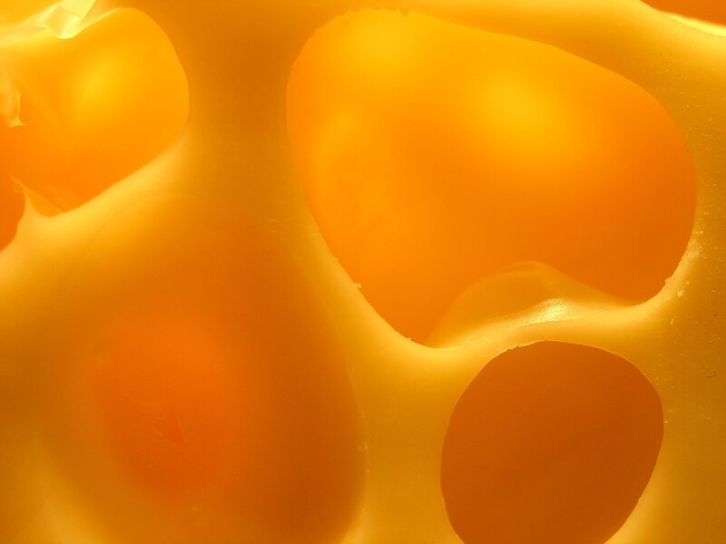 close-up of cheese holes