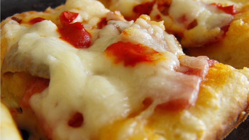 close-up of cheesy pizza