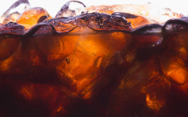 close-up of cola with ice