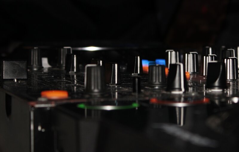 close-up of DJ mixer controls