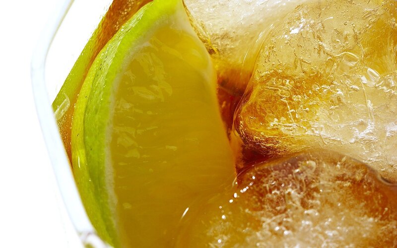 close-up of drink with lime and ice