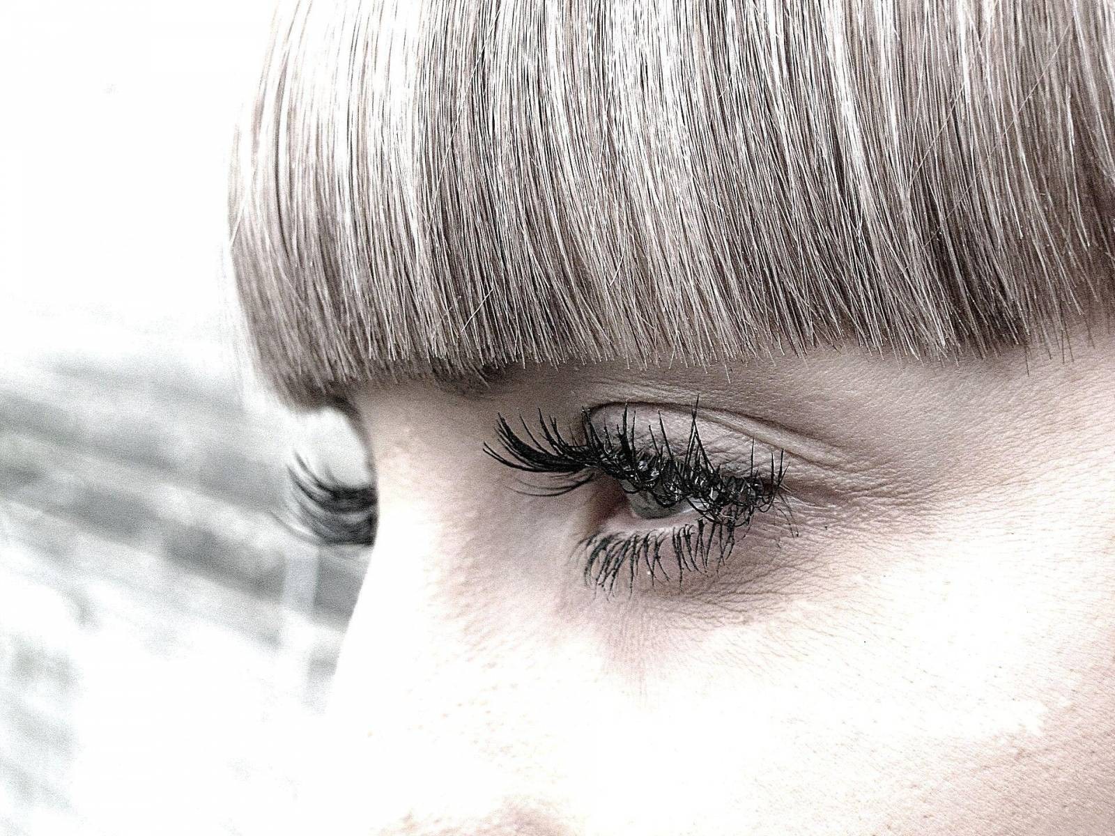 close-up of eye with bangs