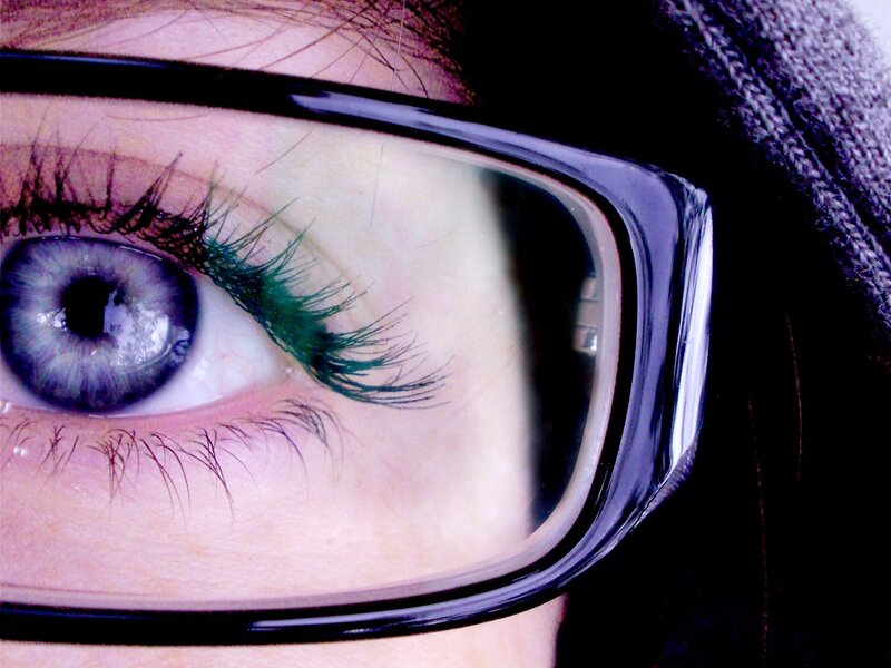 close-up of eye with glasses