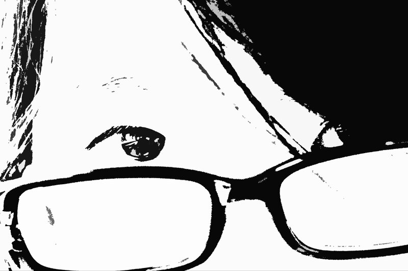 close-up of eye with glasses
