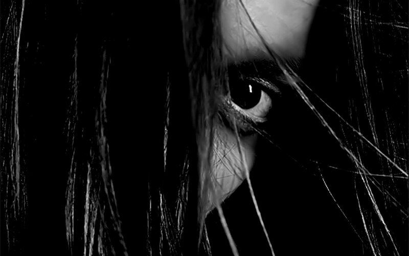 close-up of eye with hair