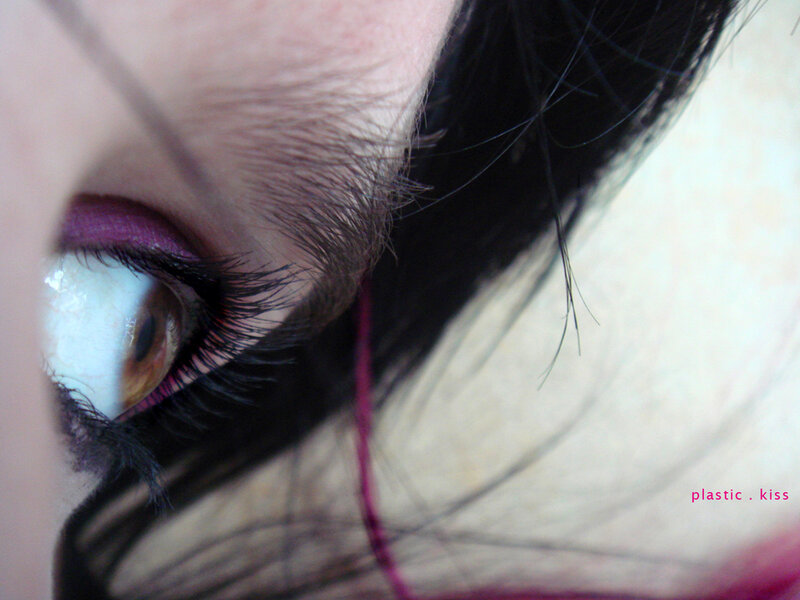 close-up of eye with purple makeup