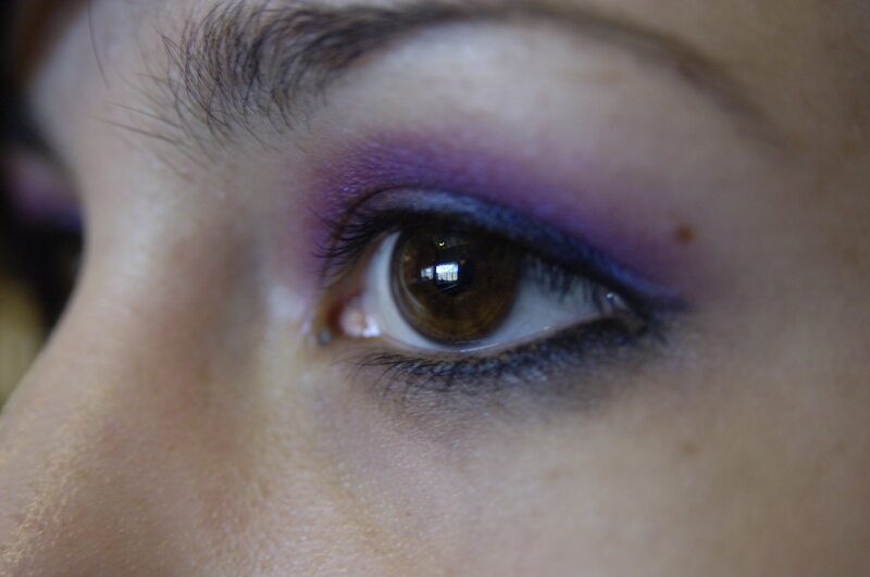 close-up of eye with purple makeup