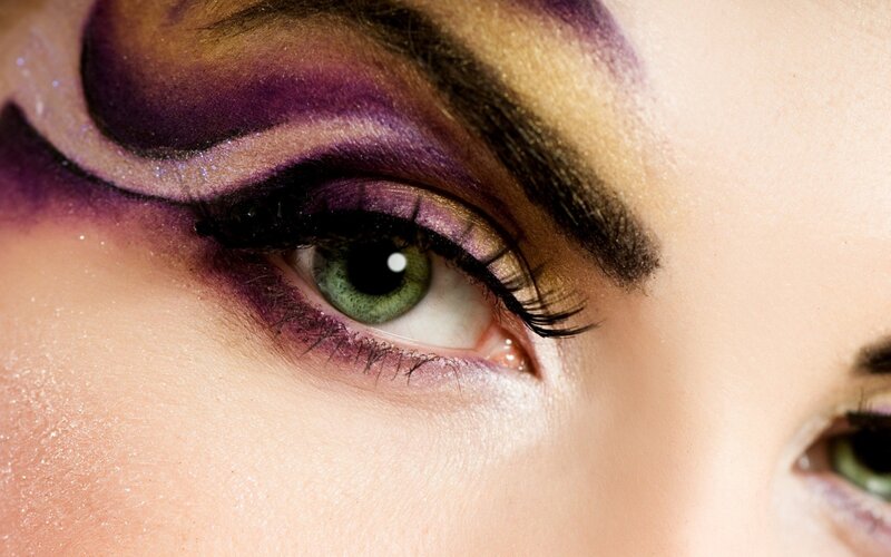 close-up of eye with purple makeup