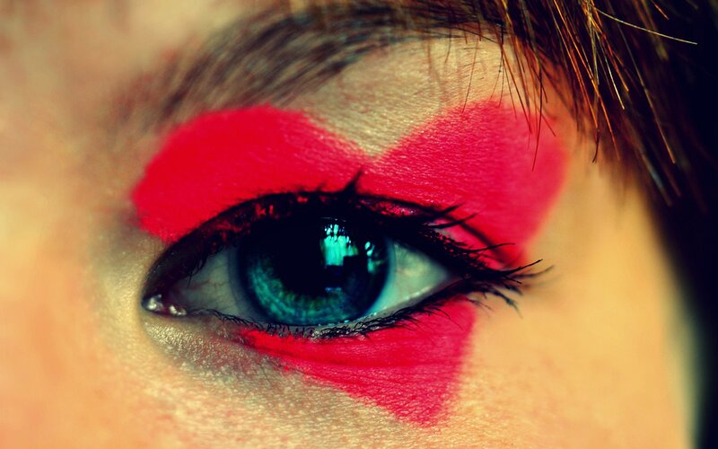 close-up of eye with red makeup