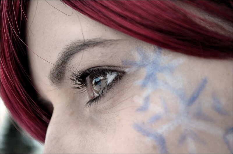 close-up of eye with snowflake makeup