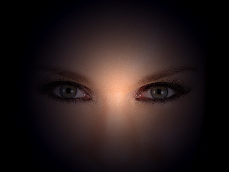 close-up of eyes in darkness