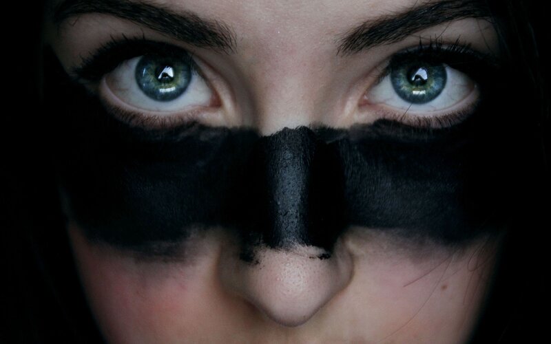 close-up of eyes with black mask