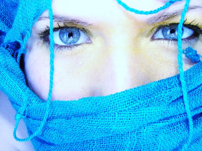 close-up of eyes with blue mask