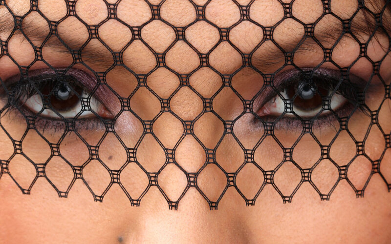 close-up of eyes with veil