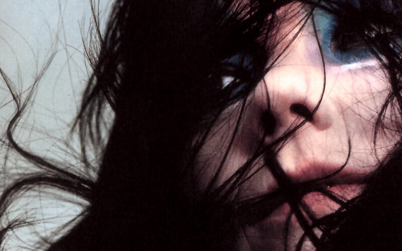 close-up of face with dark hair