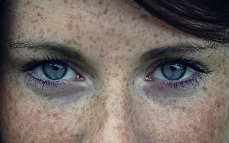 close-up of freckled eyes