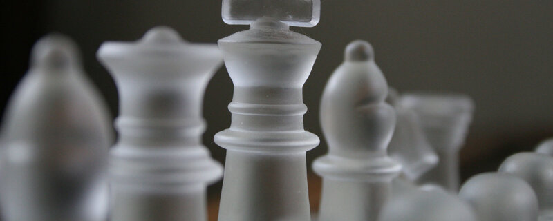 Close-up of frosted chess pieces