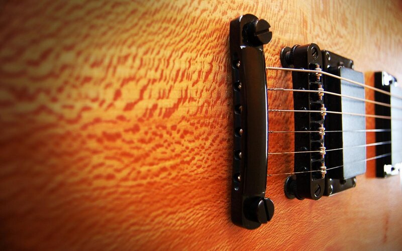 Close-up of Guitar Bridge — Brown