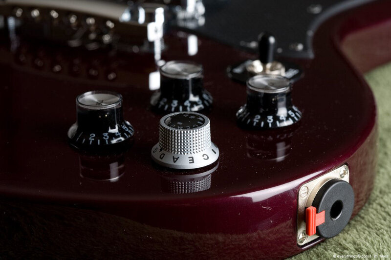 close-up of guitar controls