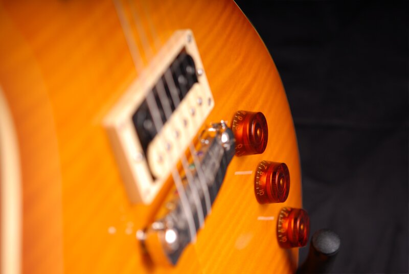 close-up of guitar controls