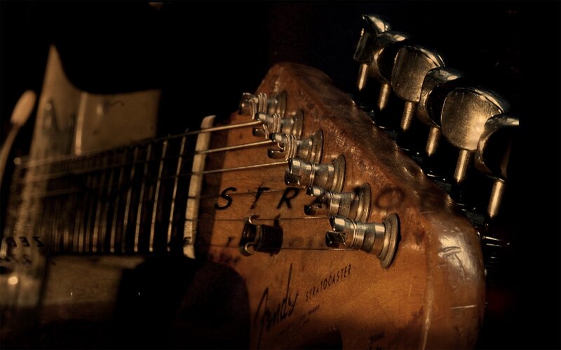 Close-up of Guitar Headstock — Brown, Dramatic