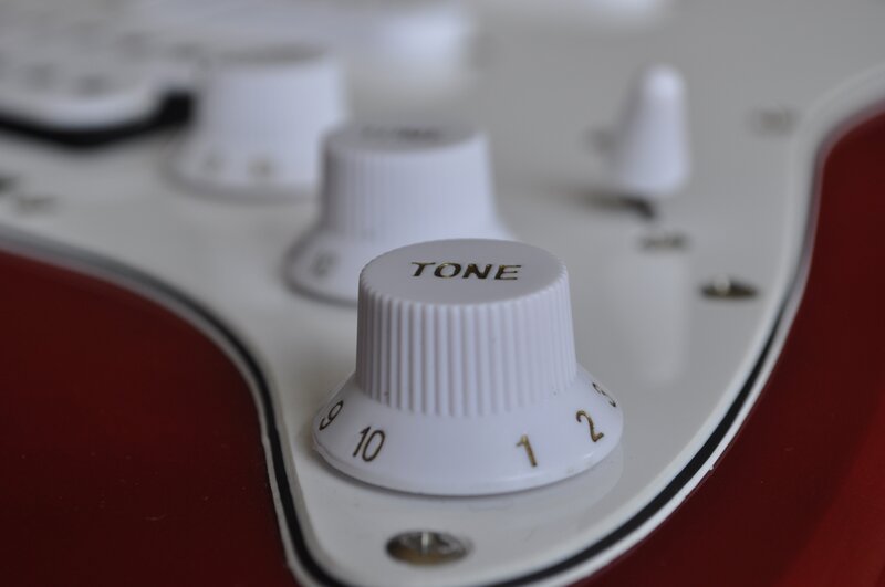 Close-up of Guitar Knobs — White, Neutral