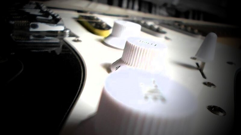 Close-up of Guitar Knobs — White