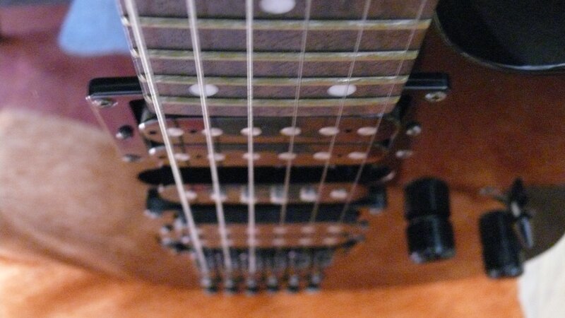 Close-up of Guitar Strings — Brown, Neutral, Photograph, Fretboard