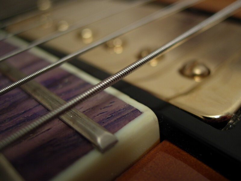 Close-up of Guitar Strings — Purple