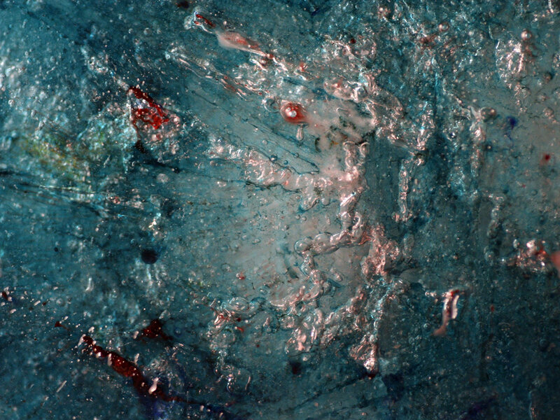 Close-up of ice with red inclusions
