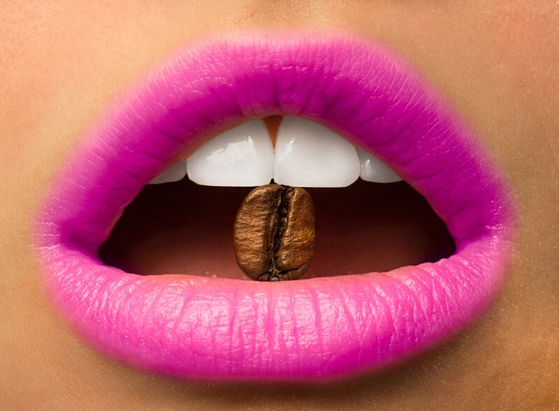 Close-up of Lips and Coffee Bean