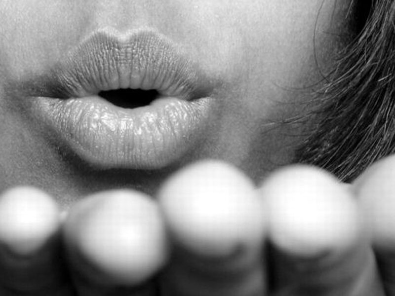 Close-up of Lips and Fingers — Black