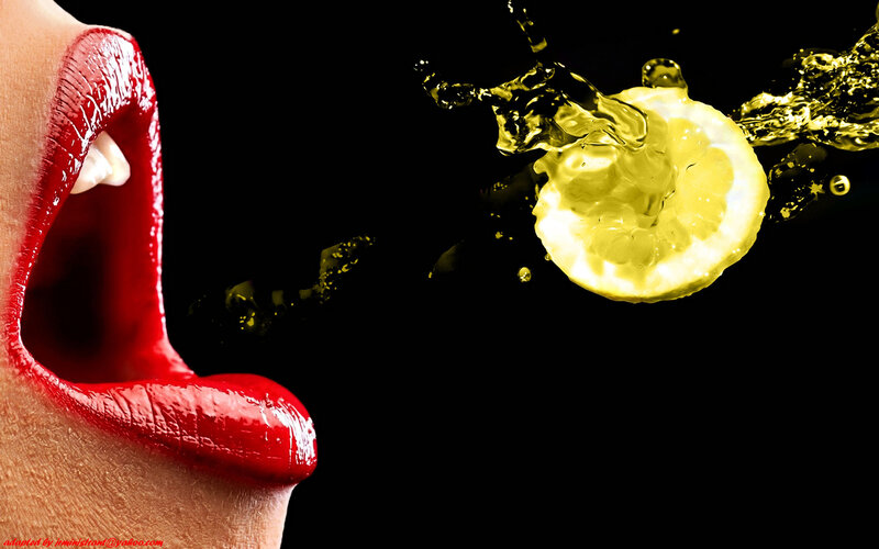 Close-up of Lips and Lemon
