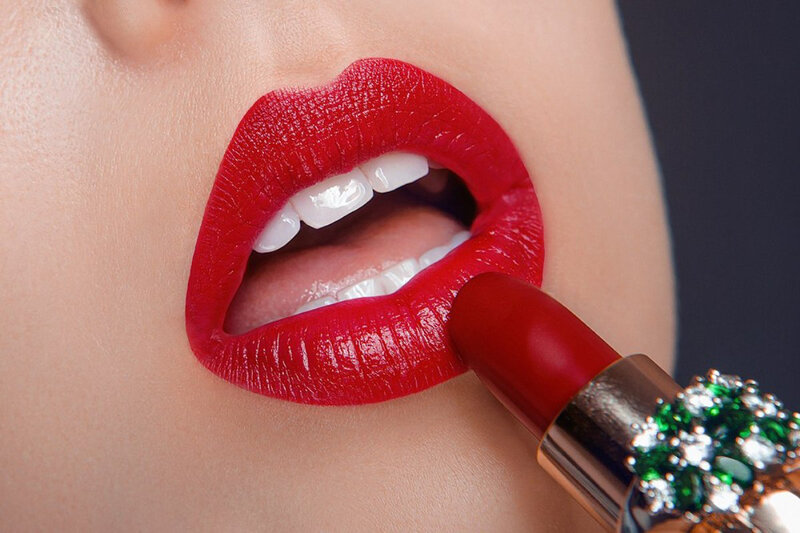 Close-up of Lips Applying Lipstick — Red, Dramatic, Photograph, Teeth