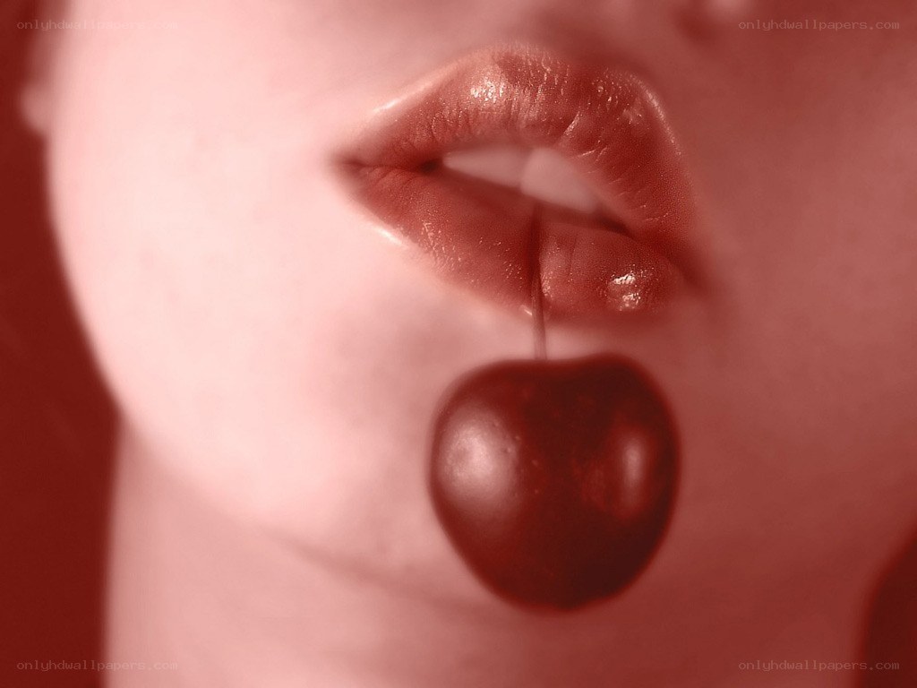close-up of lips with cherry