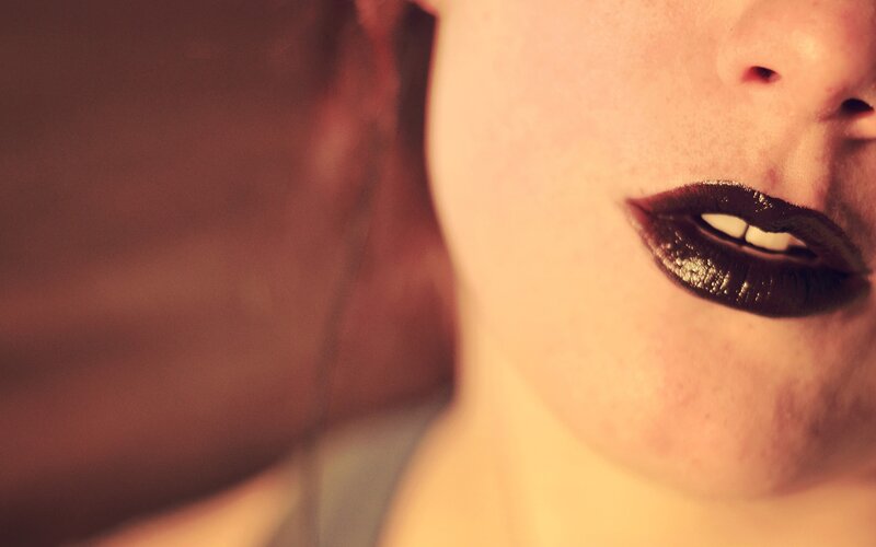 close-up of lips with dark lipstick