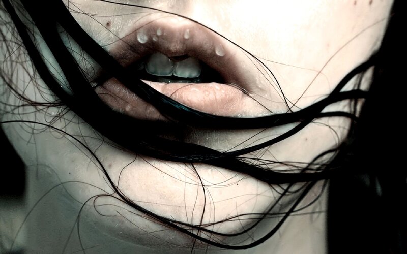 close-up of lips with hair