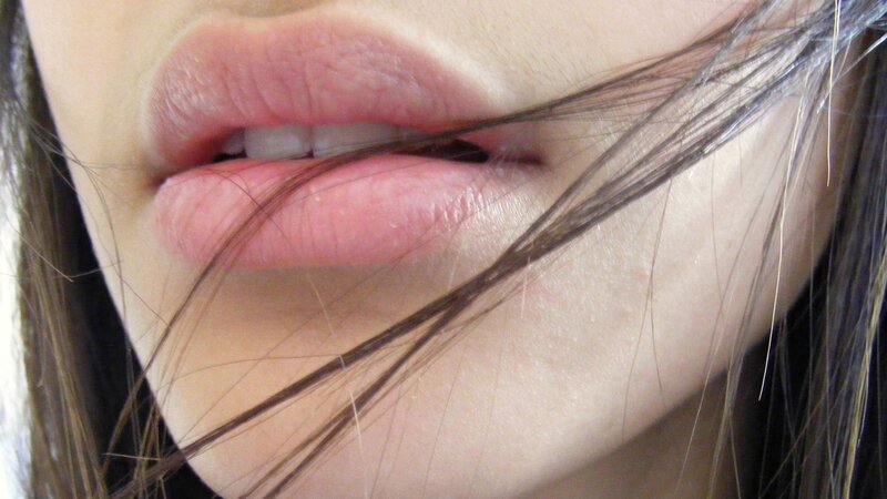 close-up of lips with hair