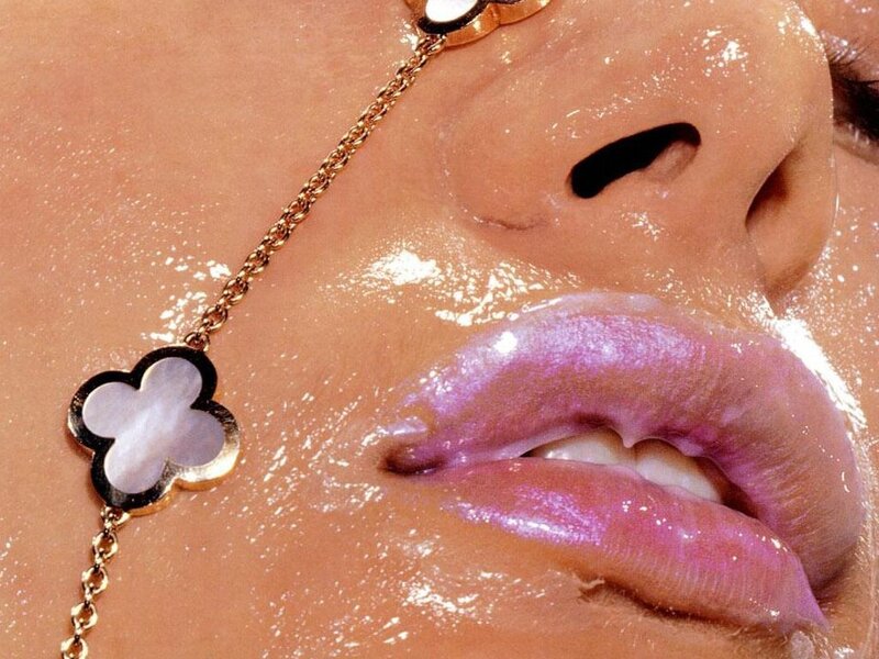 Close-up of lips with jewelry