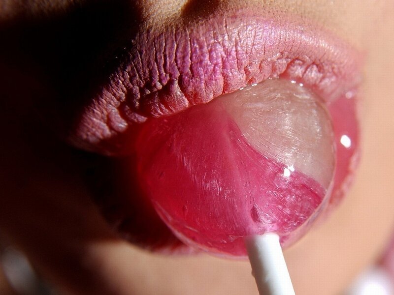 close-up of lips with lollipop
