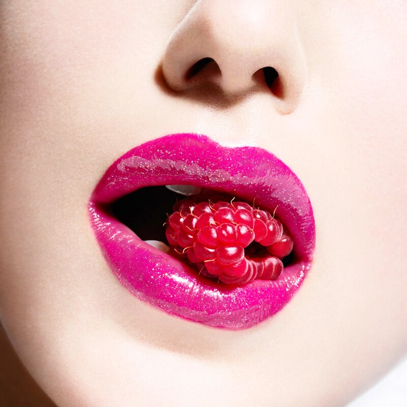 Close-up of Lips with Raspberry