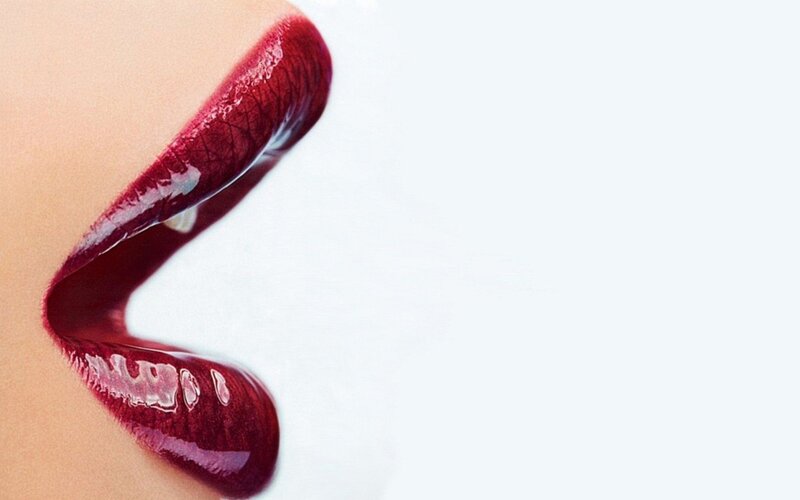 close-up of lips with red lipstick
