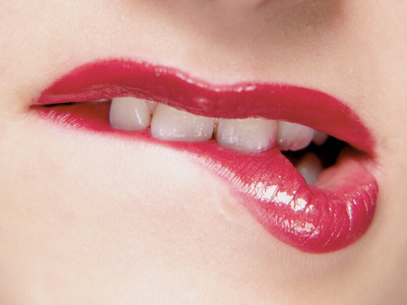 close-up of lips with red lipstick