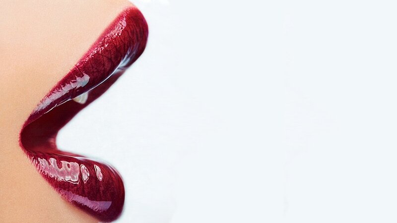 close-up of lips with red lipstick