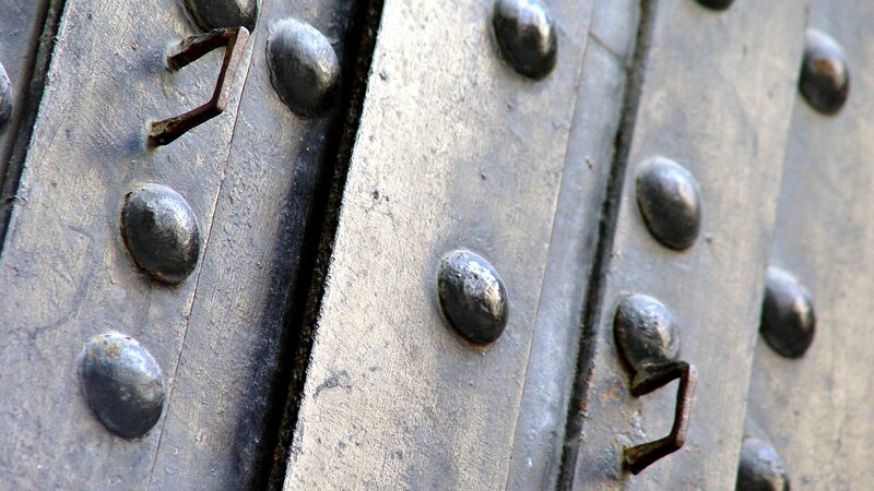 close-up of metal door with rivets