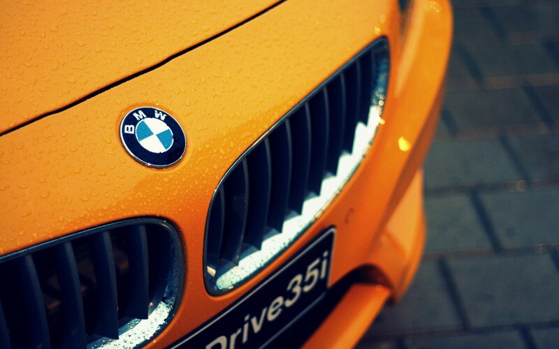 Close-up of orange BMW car